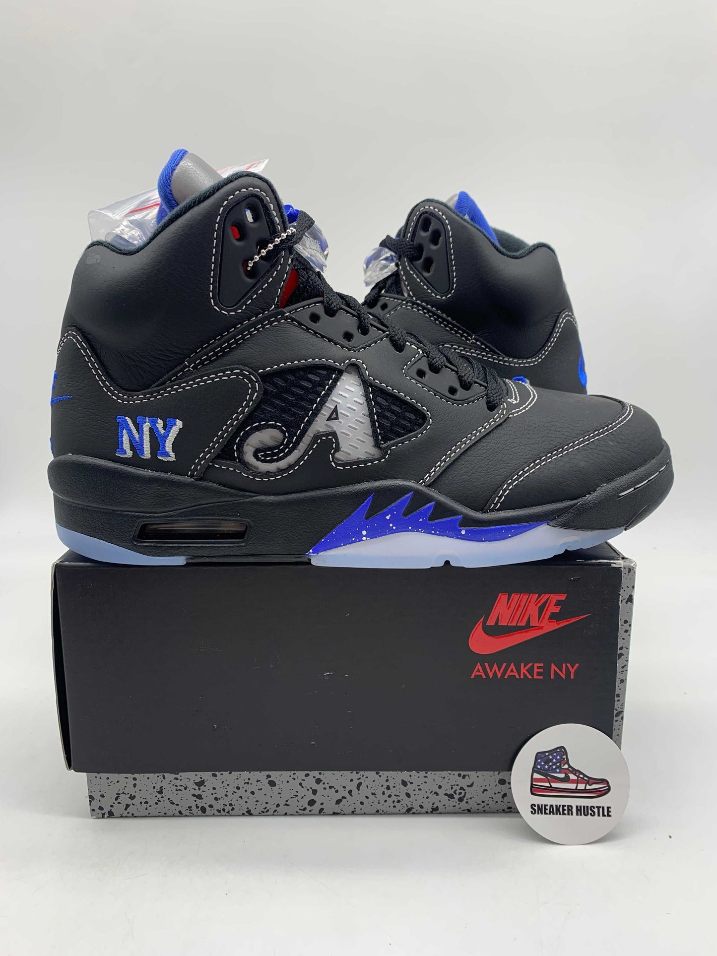 Jordan 5 Retro Awake NY Black sneakers on Nike Awake NY box with blue and black detailing