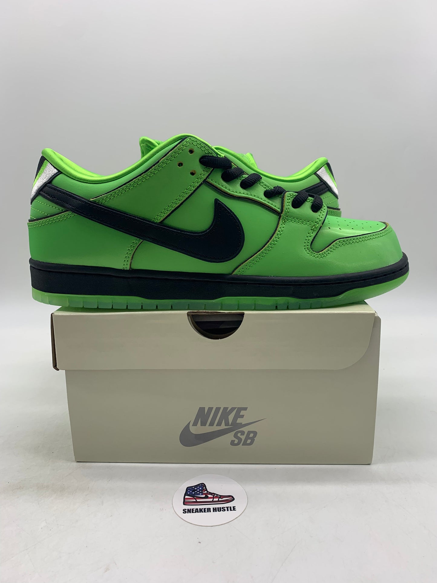 Nike SB Dunk Low The Powerpuff Girls Buttercup green and black sneaker on a Nike SB box