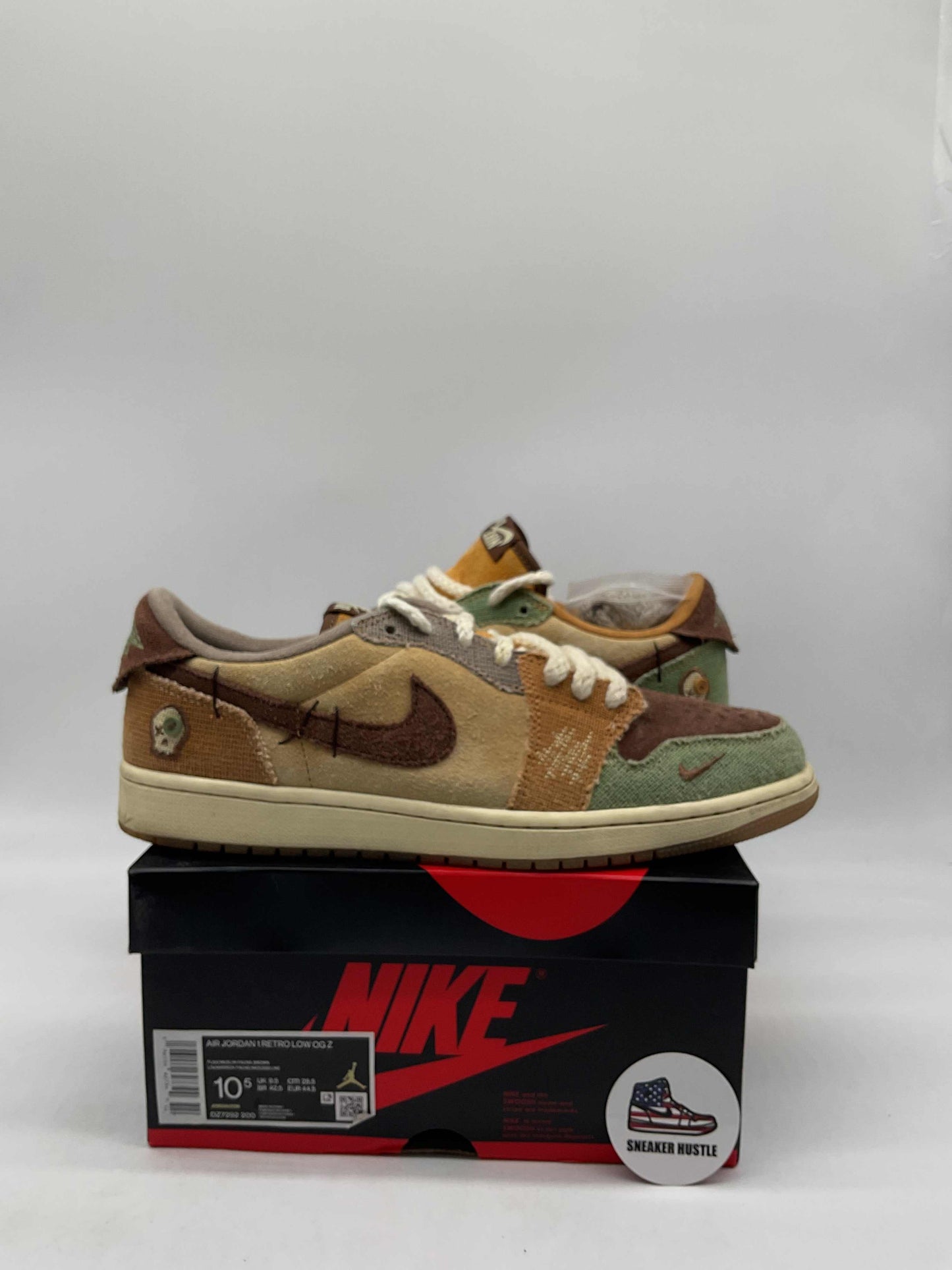 Preowned Jordan 1 Retro Low OG Zion Williamson Voodoo sneakers size 10.5 on Nike shoebox with Sneaker Hustle sticker