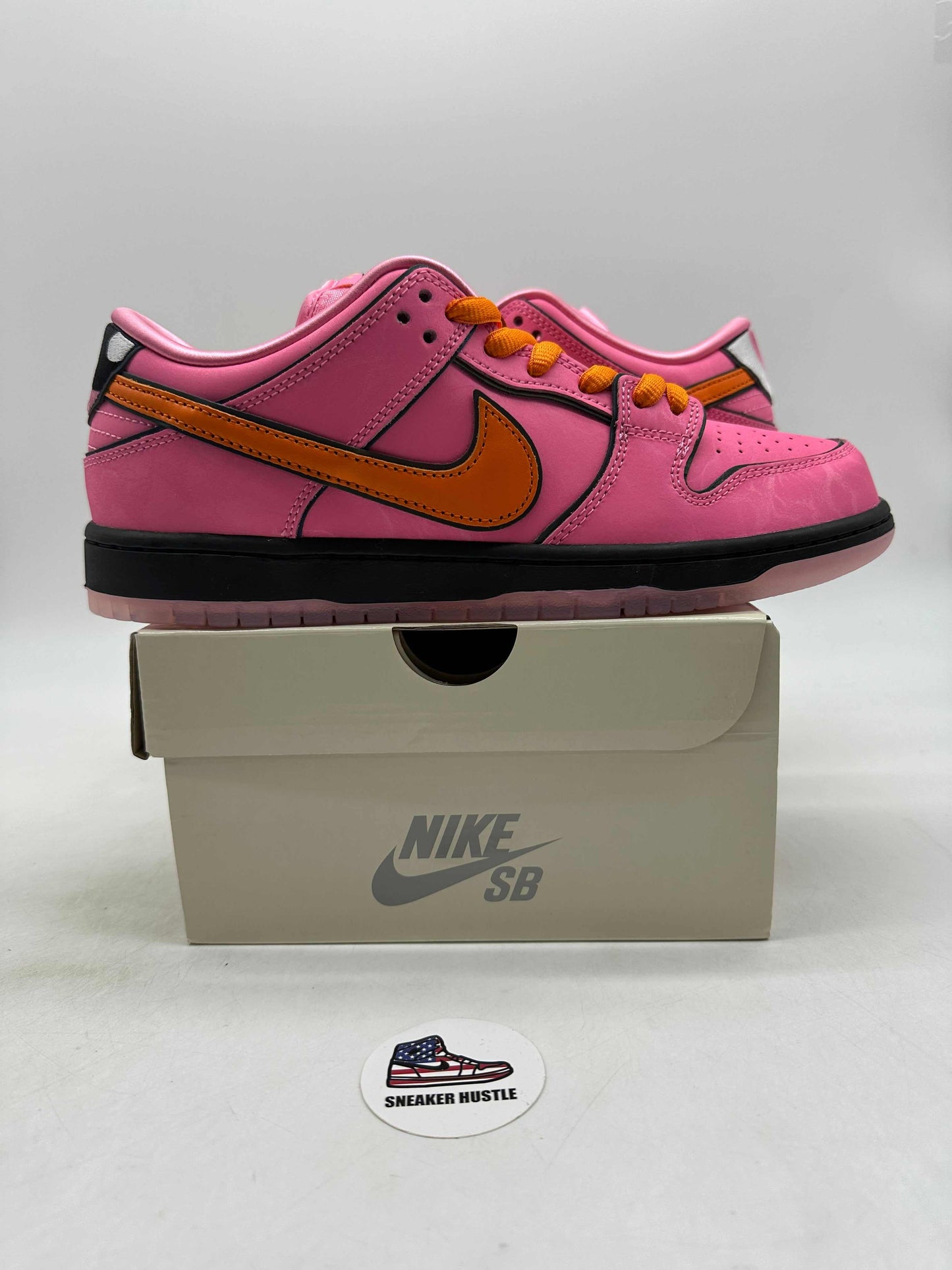 Nike SB Dunk Low The Powerpuff Girls Blossom pink and orange skate shoe on Nike SB box