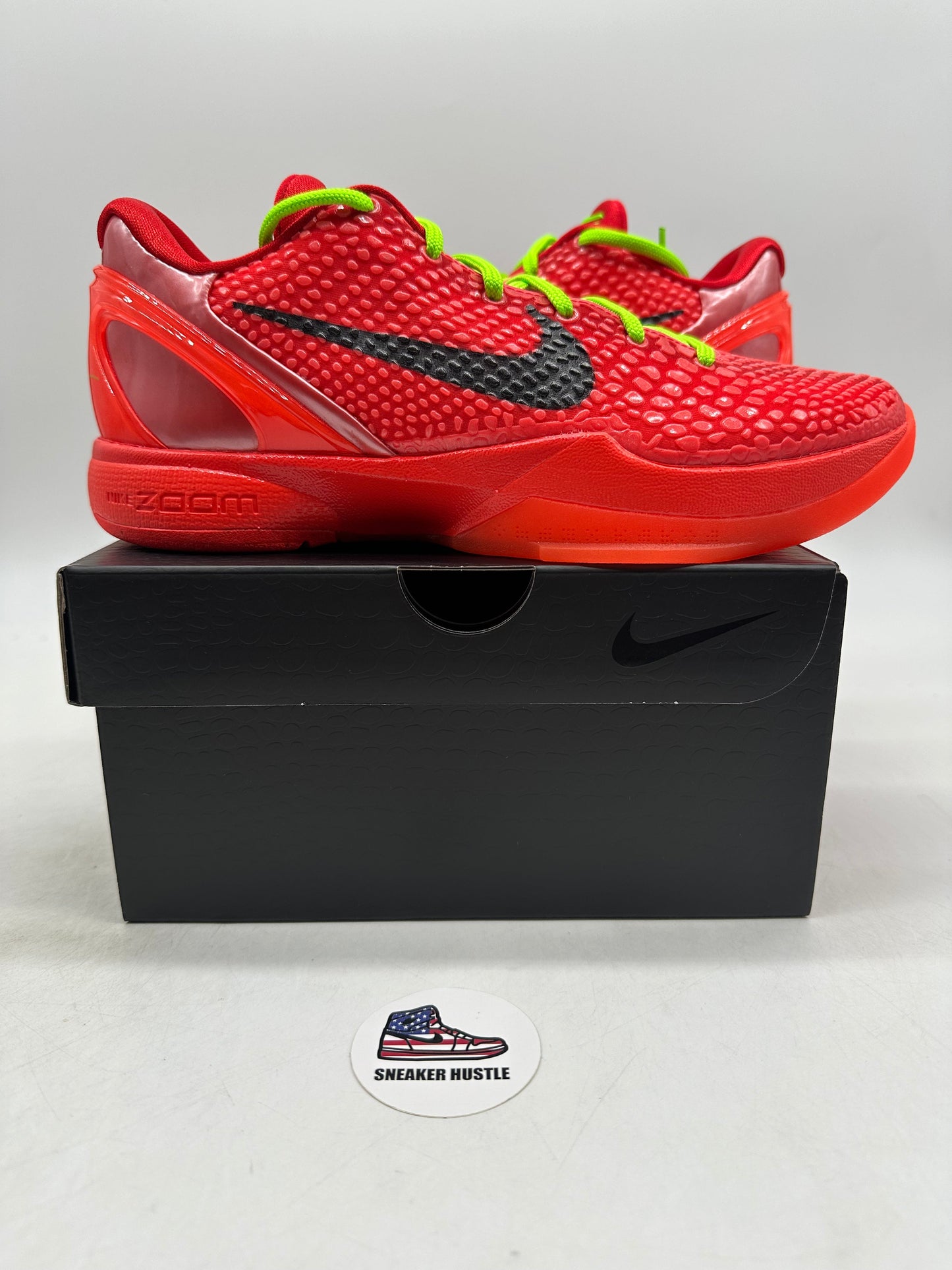 Nike Kobe 6 Protro Reverse Grinch basketball shoes in red with black swoosh on black box