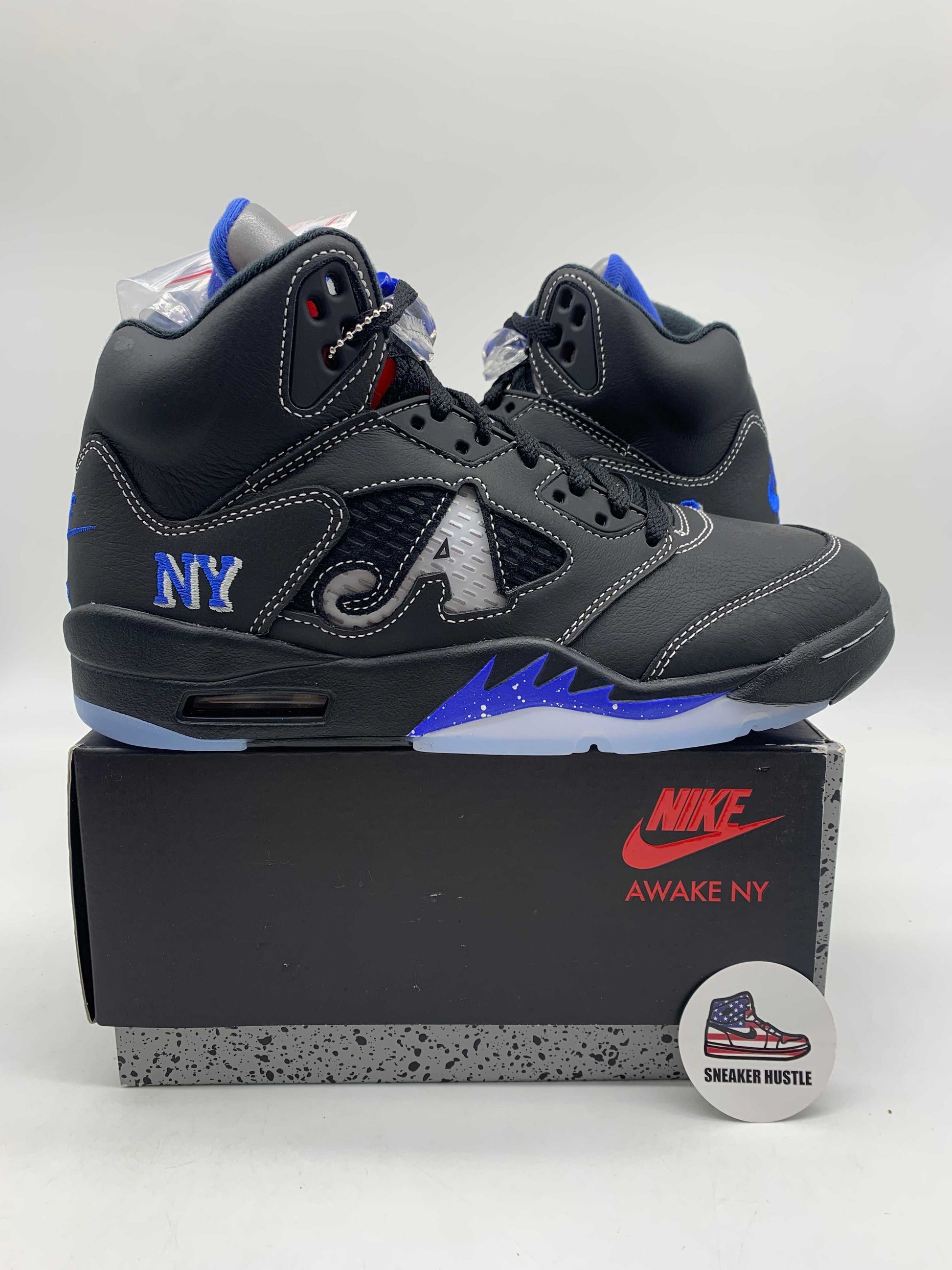 Jordan 5 Retro Awake NY Black sneakers on Nike Awake NY box with blue and black detailing