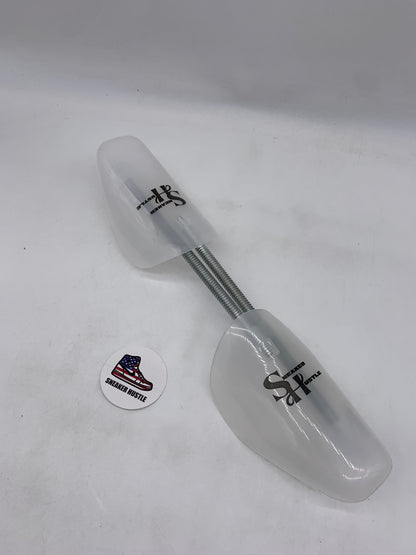 Sneaker Hustle shoe tree pair with adjustable metal spring and white plastic ends