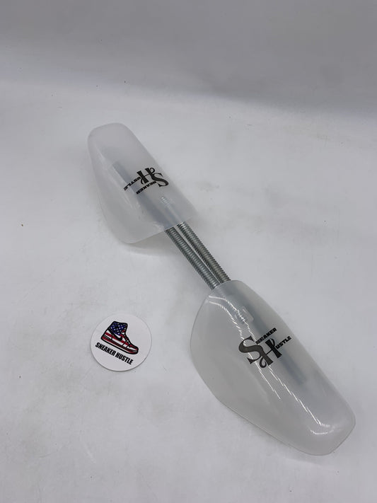 Sneaker Hustle shoe tree pair with adjustable metal spring and white plastic ends