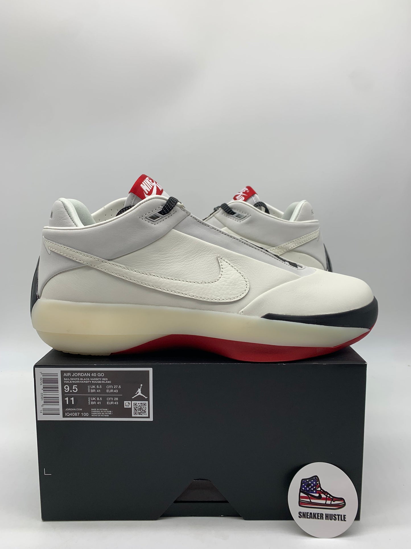 Jordan 40 Chicago white sneaker on black box with red and black sole and Nike swoosh, size 9.5 US