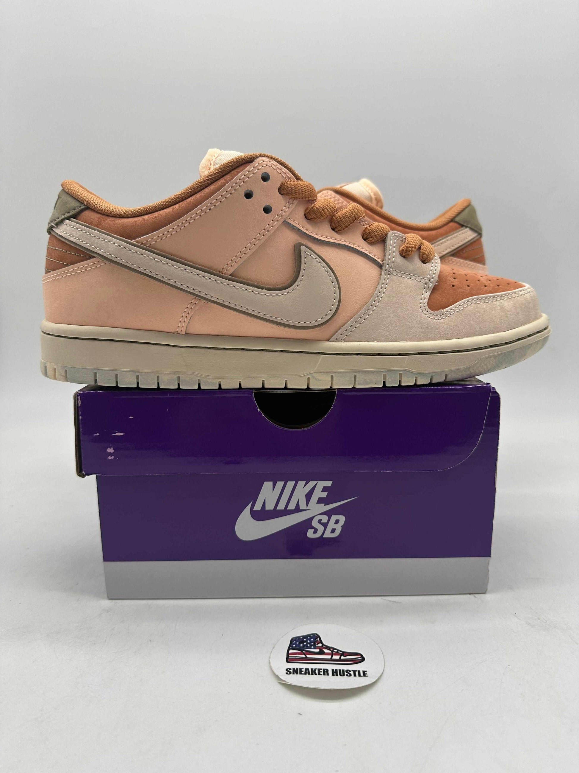 Nike SB Dunk Low Trocadéro Gardens in pink and beige colorway on purple Nike SB box