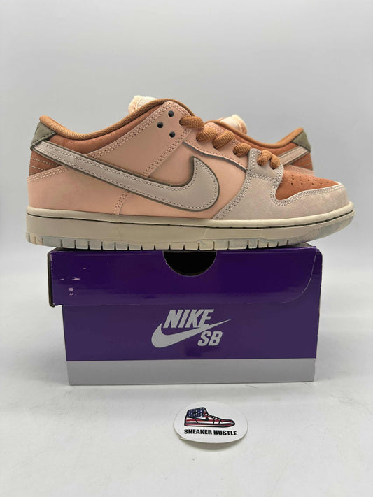 Nike SB Dunk Low Trocadéro Gardens in pink and beige colorway on purple Nike SB box