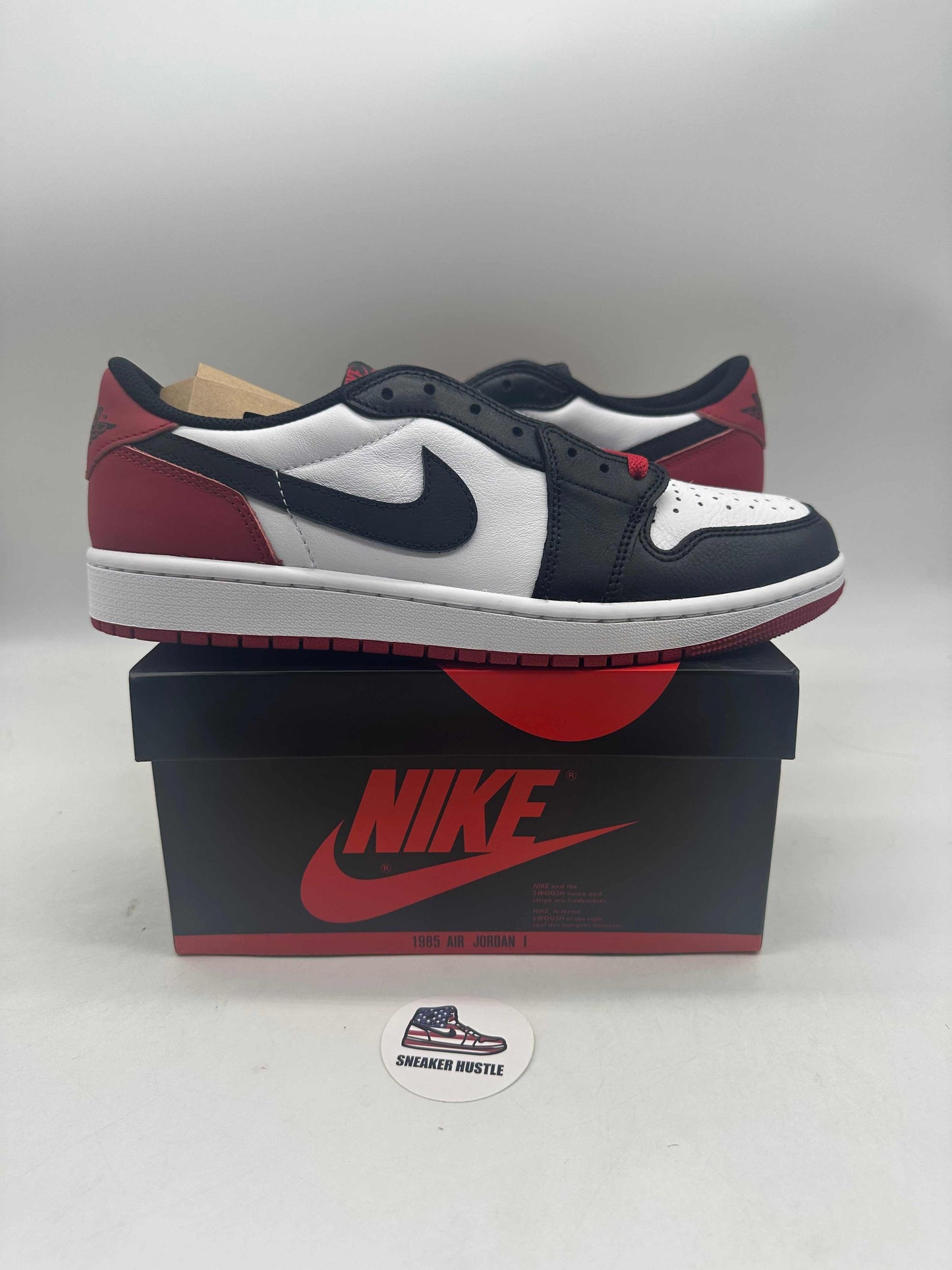 Jordan 1 Retro Low OG Black Toe 2023 sneakers on Nike box