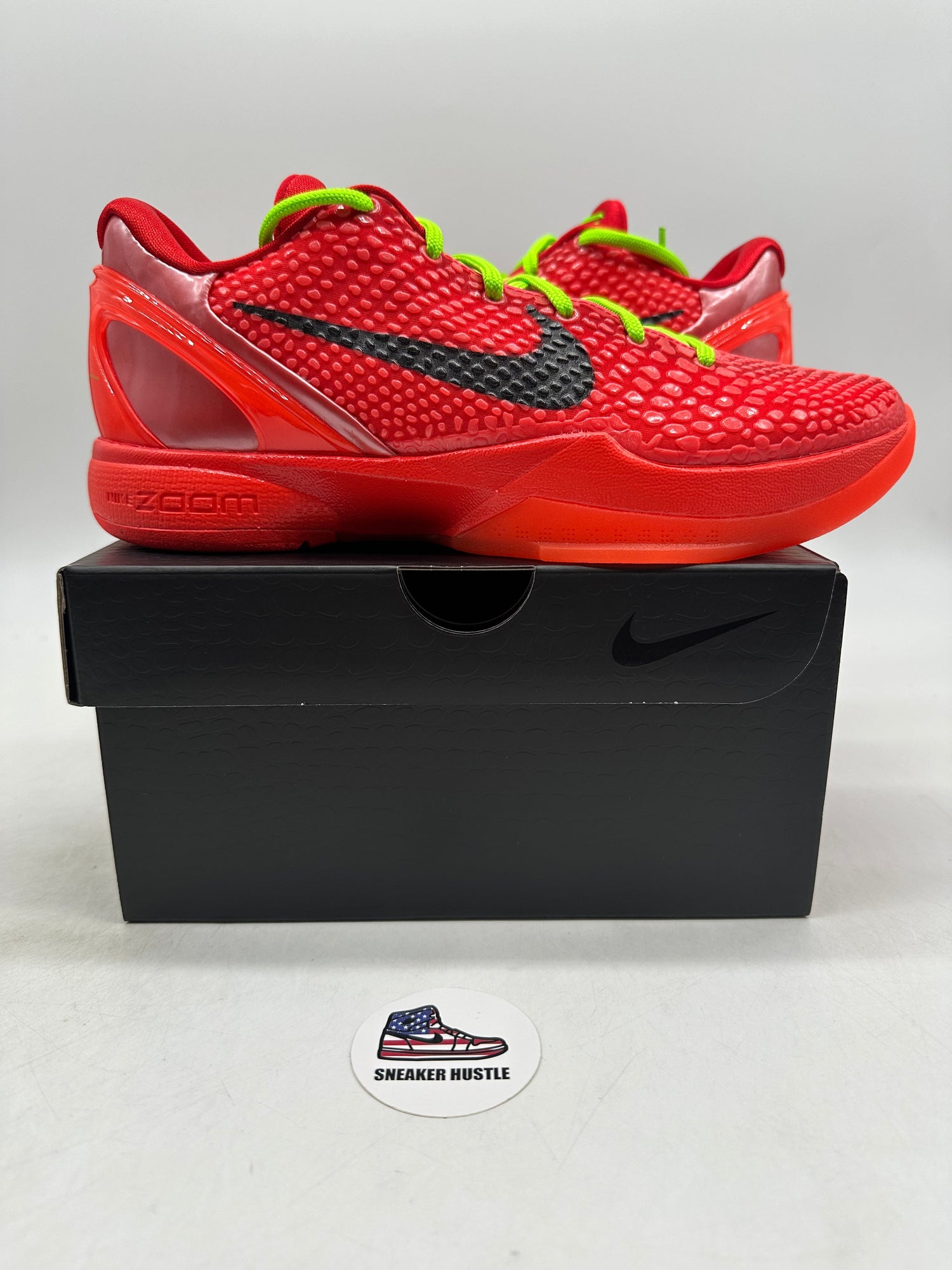 Nike Kobe 6 Protro Reverse Grinch basketball shoes in red with black swoosh on black box